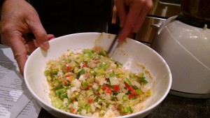 mixing leek fritter ingredients