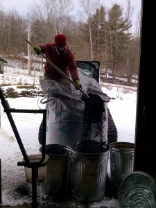 mari shoveling biochar