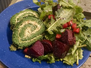 spinach roulade slices with spring roasted beets and greens salad