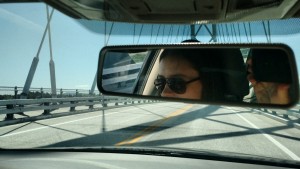 chloe driving on bridge