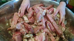 mixing meat maple and spices for sausage